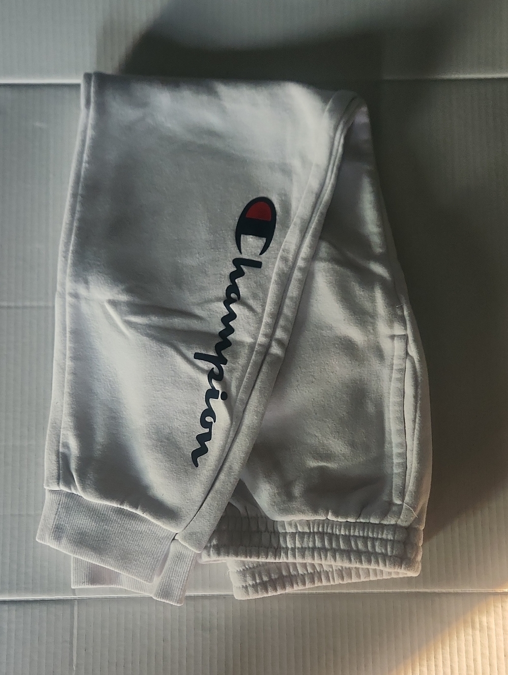 Champion Kids White Sweatpants with Script Logo and Red Accent